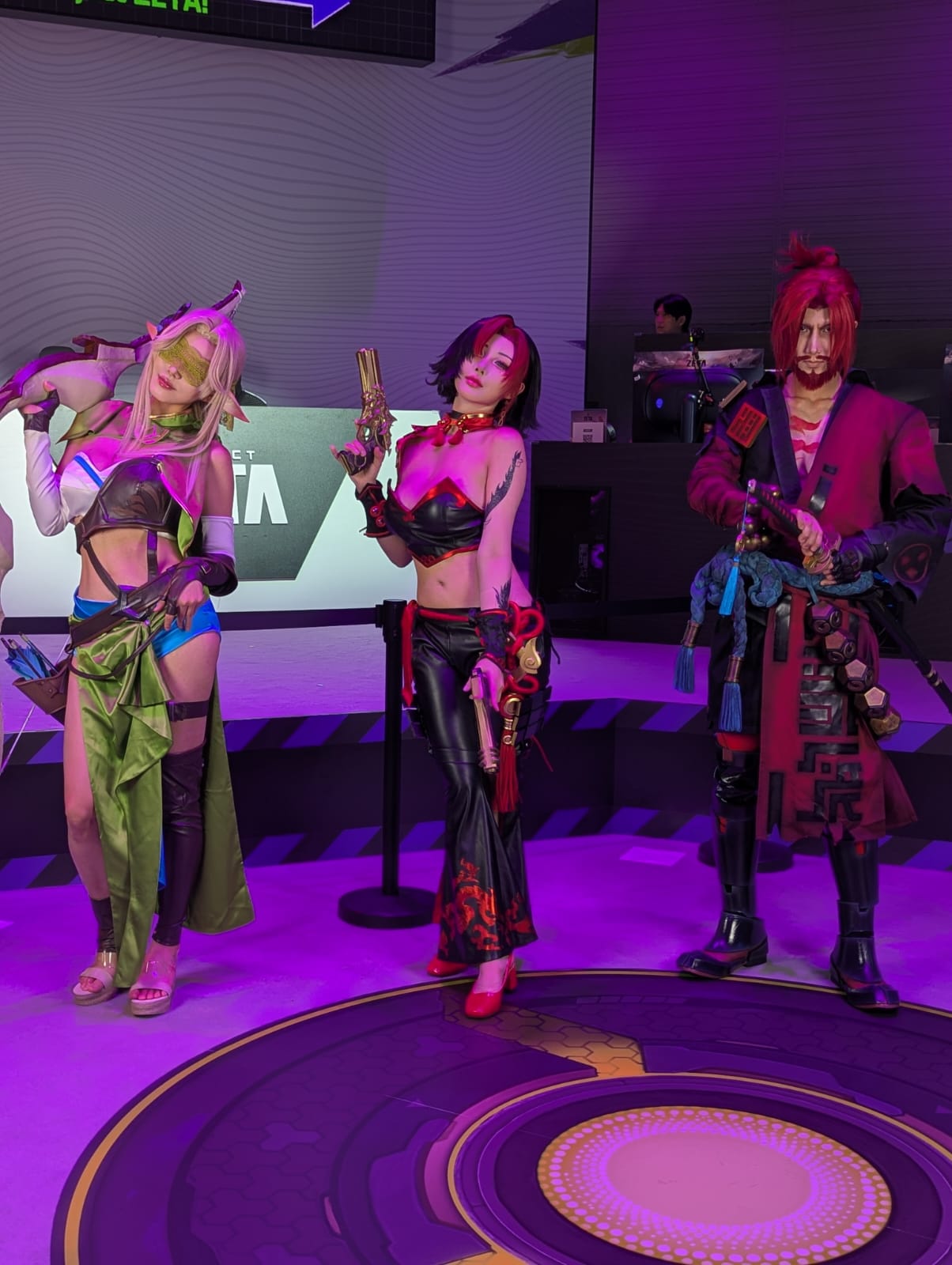 Three people dressed as video-game characters at Gamescom 2026 in Cologne